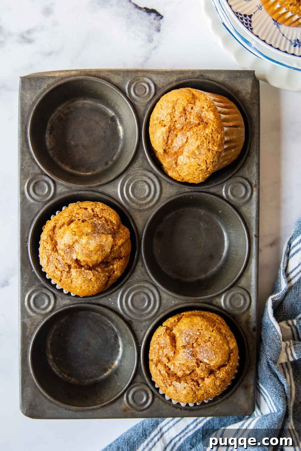 Fluffiest 5-Minute Pumpkin Oat Flour Muffins 8 overhead shot of pumpkin oat flour muffins in a vintage muffin pan