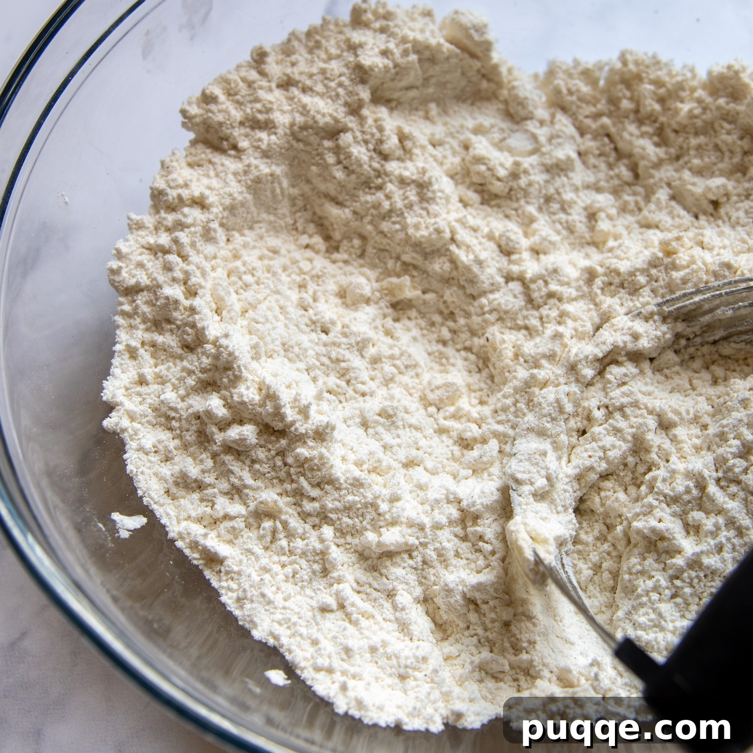 a pastry blender cutting in the butter.