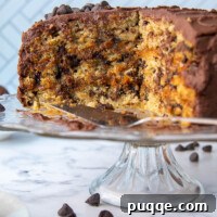 a oatmeal layer cake filled with caramel and covered in frosting sliced open on a cake platter