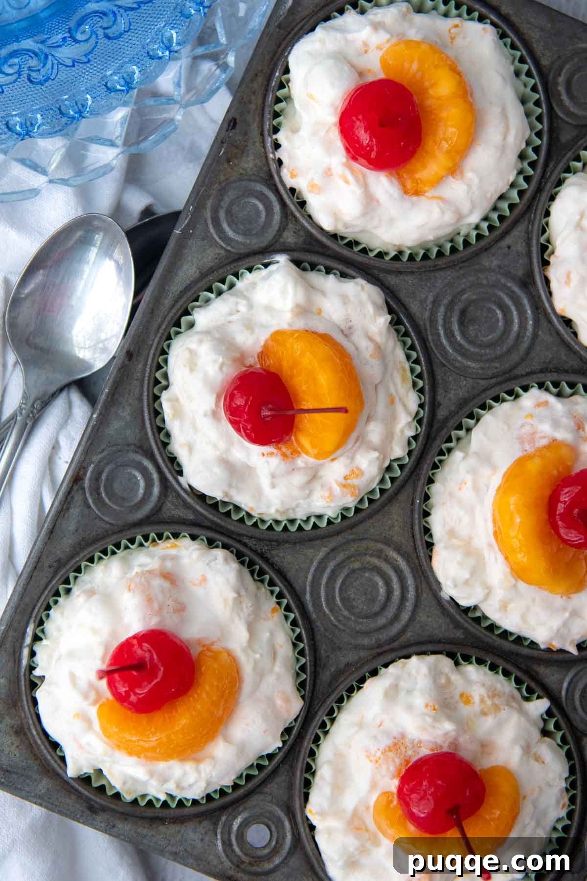 Frosty Fruit Medley 6 Overhead shot of frozen fruit salad cups arranged in an old-fashioned muffin tin.