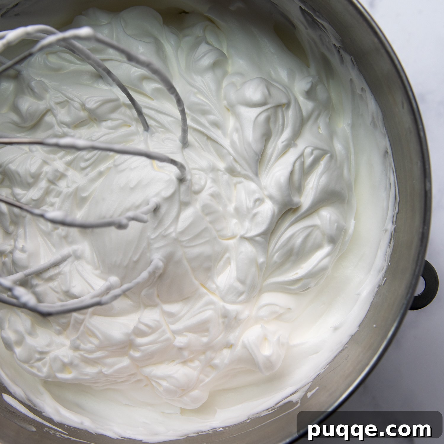 Pillowy Soft Gluten-Free Angel Food Delight 6 Glossy, stiff meringue peaks forming in a large mixing bowl.