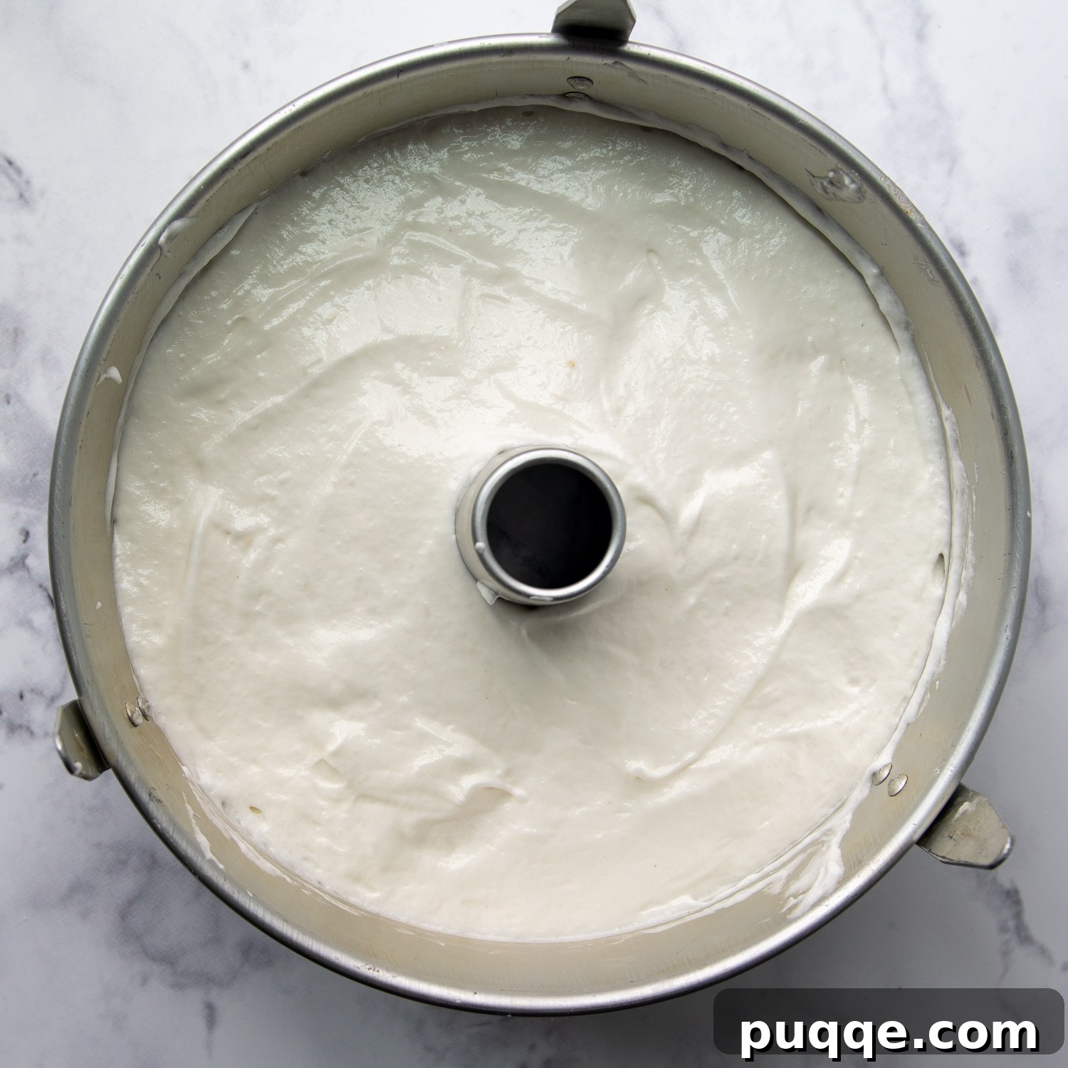 Pillowy Soft Gluten-Free Angel Food Delight 8 The cake batter evenly distributed in an ungreased tube pan, ready for baking.