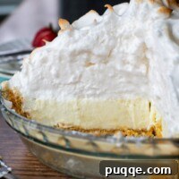 interior view of a whole frozen lemon meringue pie sliced open
