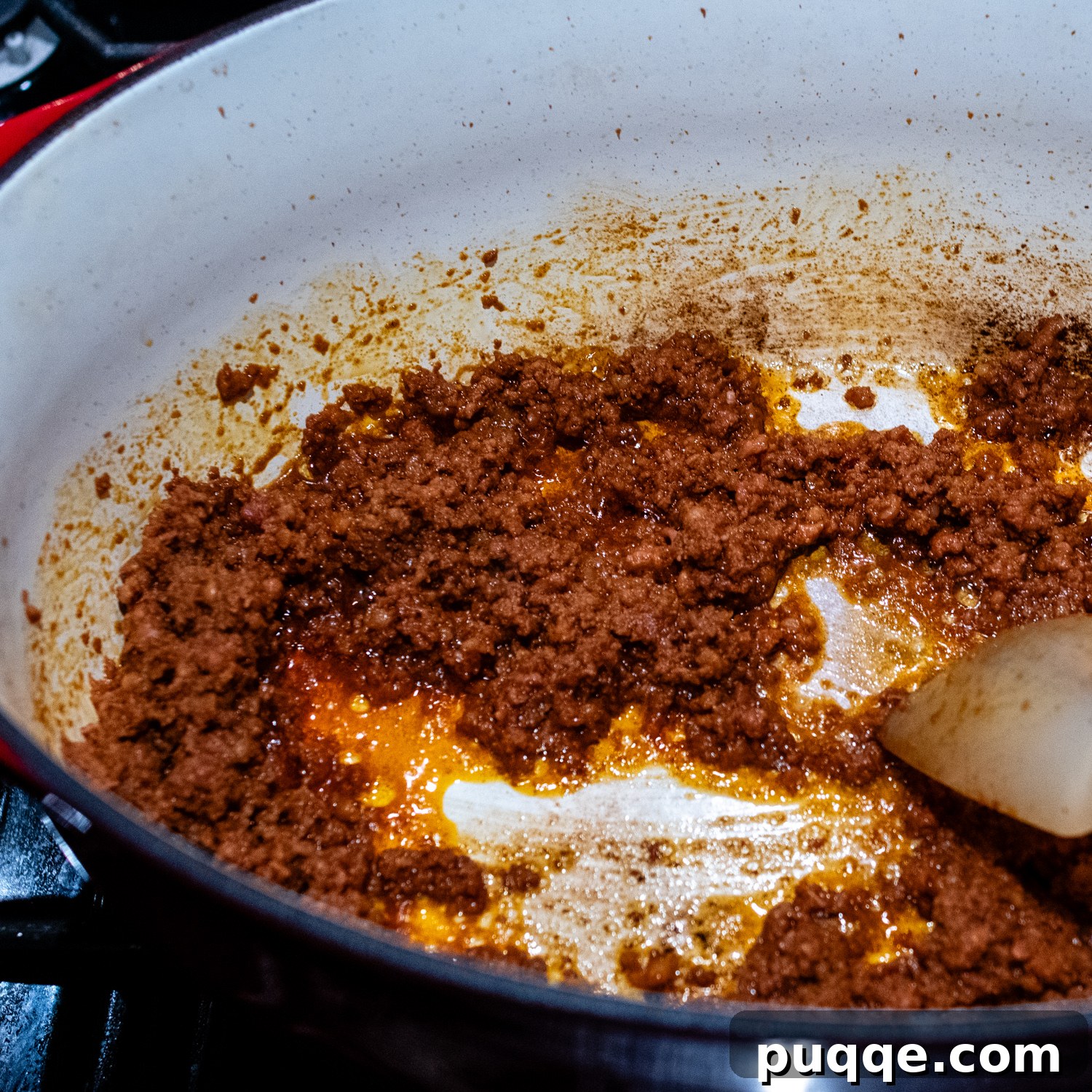 Signature Red Chicken Chorizo Chili 5 Chorizo sausage being cooked and crumbled in a large pot.