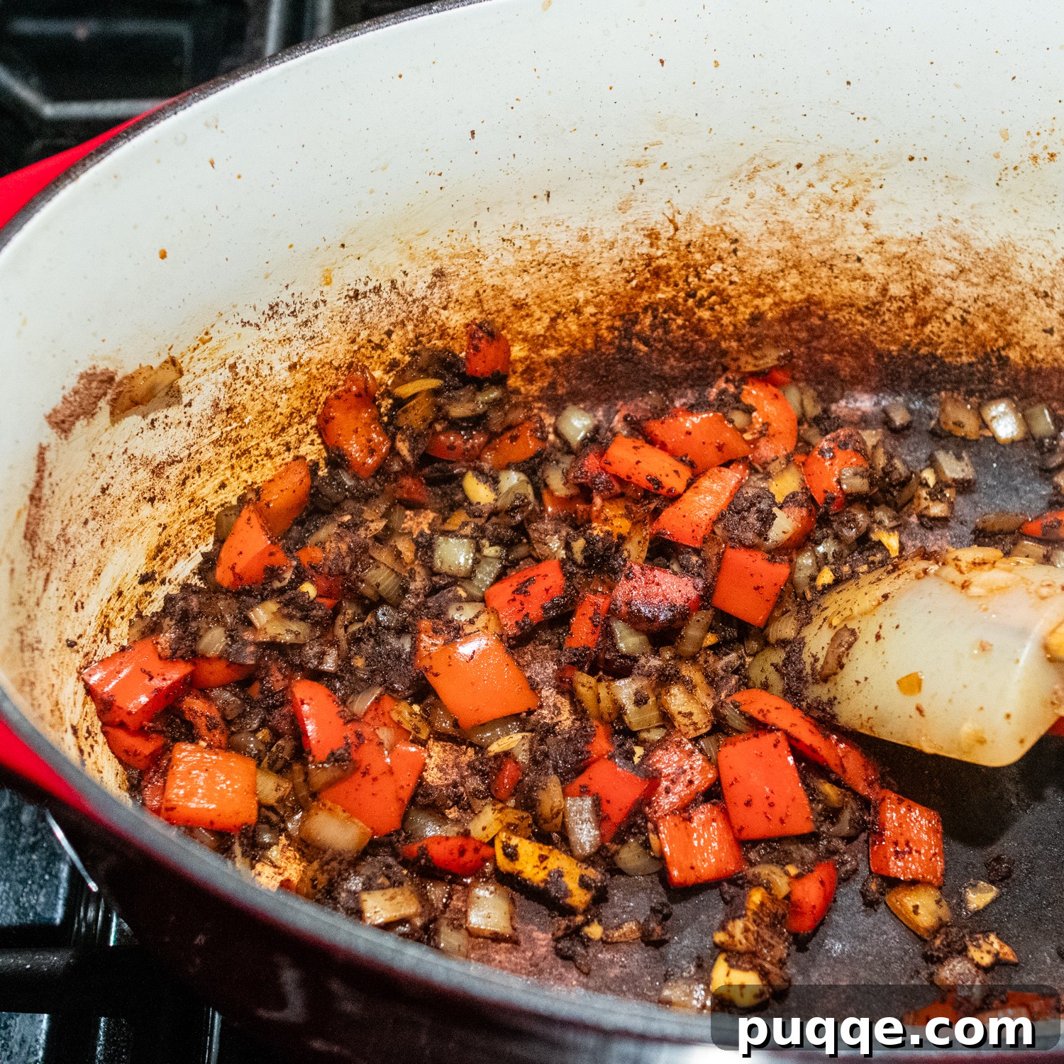 Signature Red Chicken Chorizo Chili 6 Bell peppers, onions, and spices being added and cooked in the pot.