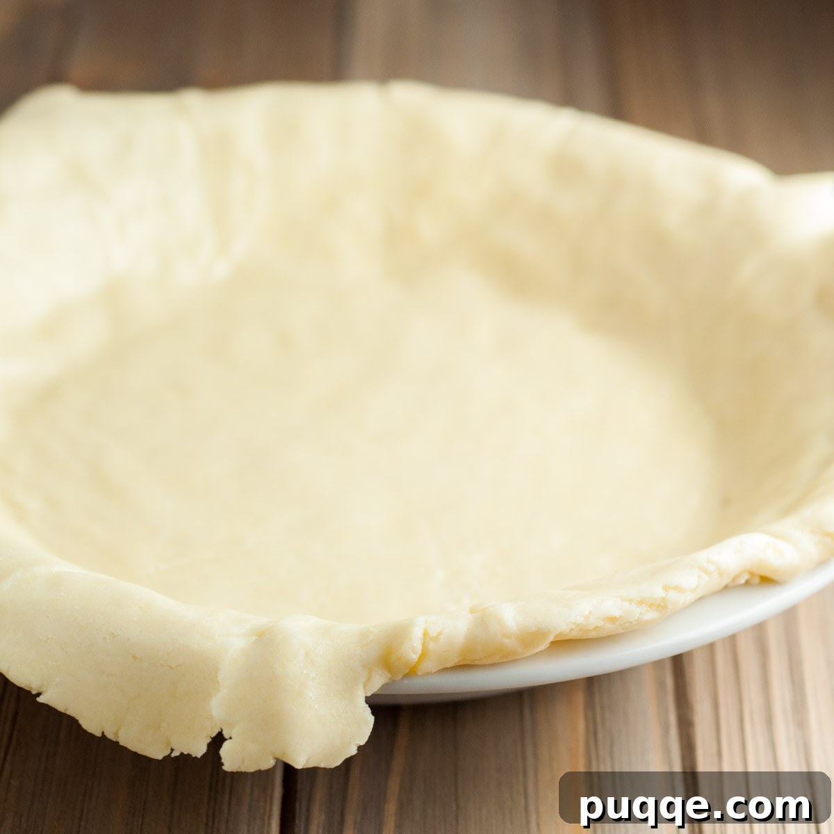 edges folded over in a pie plate.