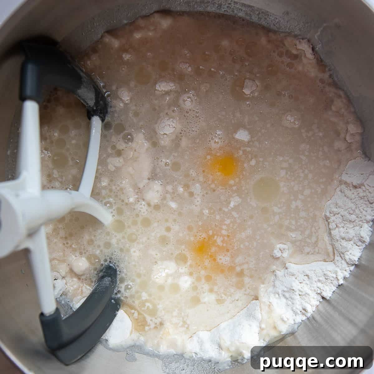 dry ingredients in a mixing bowl with the wet ingredients being added