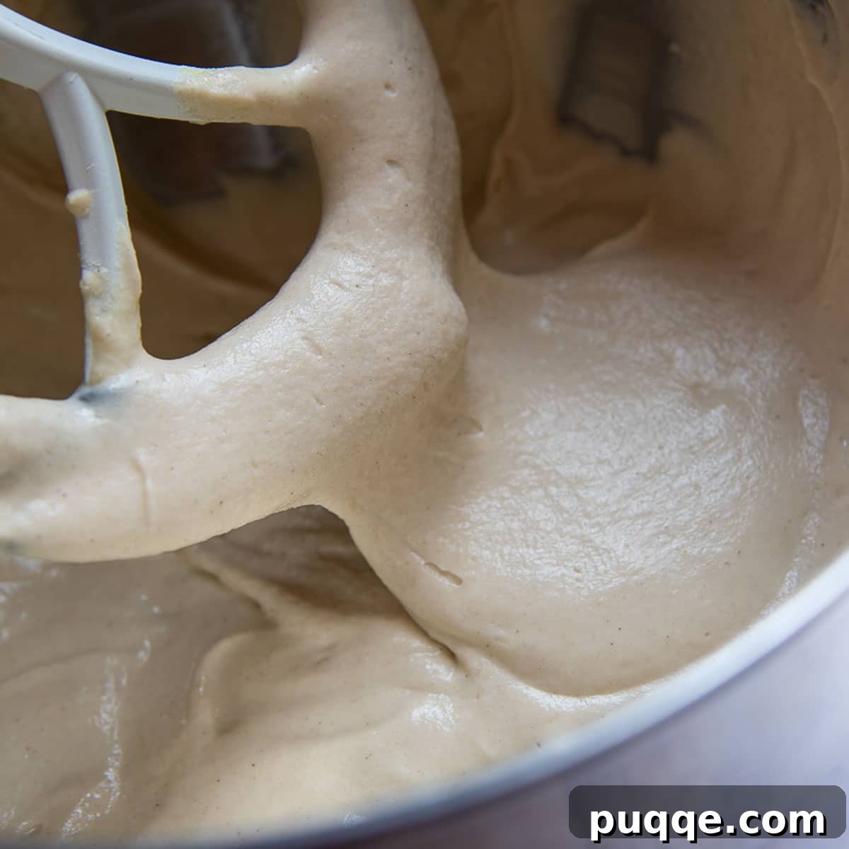image showing the slightly runny consistency of the gluten-free bread dough after beating