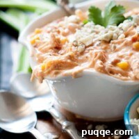 This Slow Cooker Creamy Buffalo Chicken Chili has the perfect amount of spice, a smooth creamy base, lots of tender chicken, and takes 10 minutes to prepare.