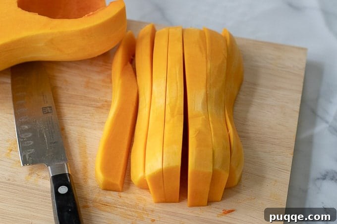 Step-by-step image showing a butternut squash being cut in half lengthwise