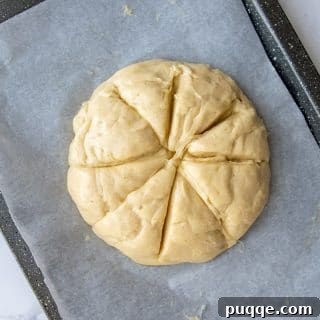 challah sliced in a star pattern before baking