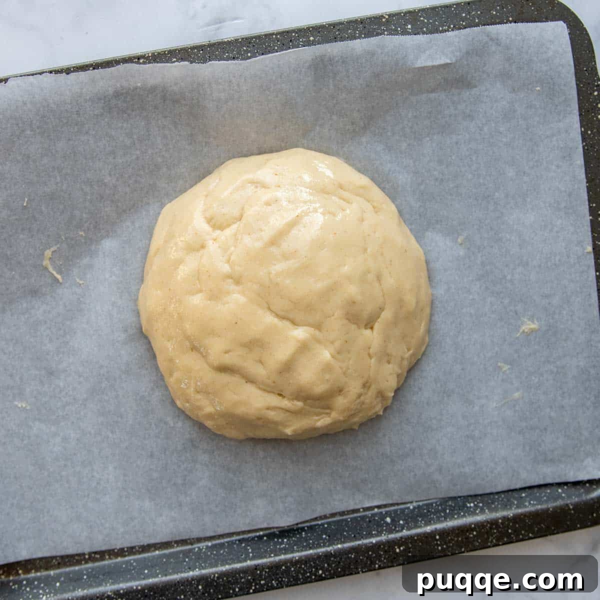 Baking Gluten Free Challah Made Easy 6 Challah dough shaped and placed on a baking sheet, ready for its final rise before baking.
