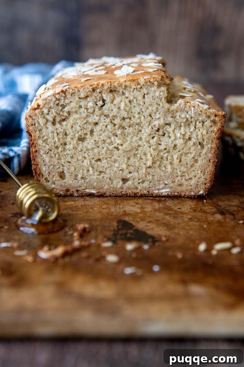 oat flour bread sliced open and facing straight on, showcasing its soft crumb and inviting texture
