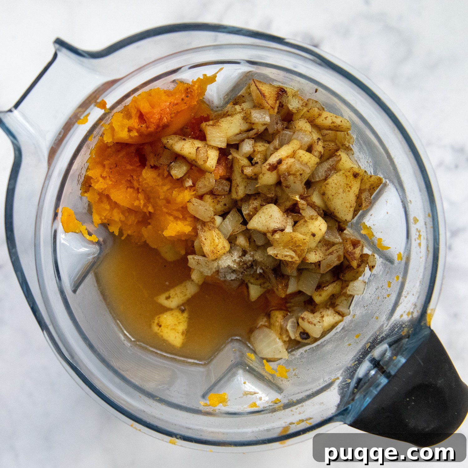 The Ultimate Panera Style Butternut Squash Soup Homemade Perfection 5 the squash, apples and onions about to be puréed in a blender.