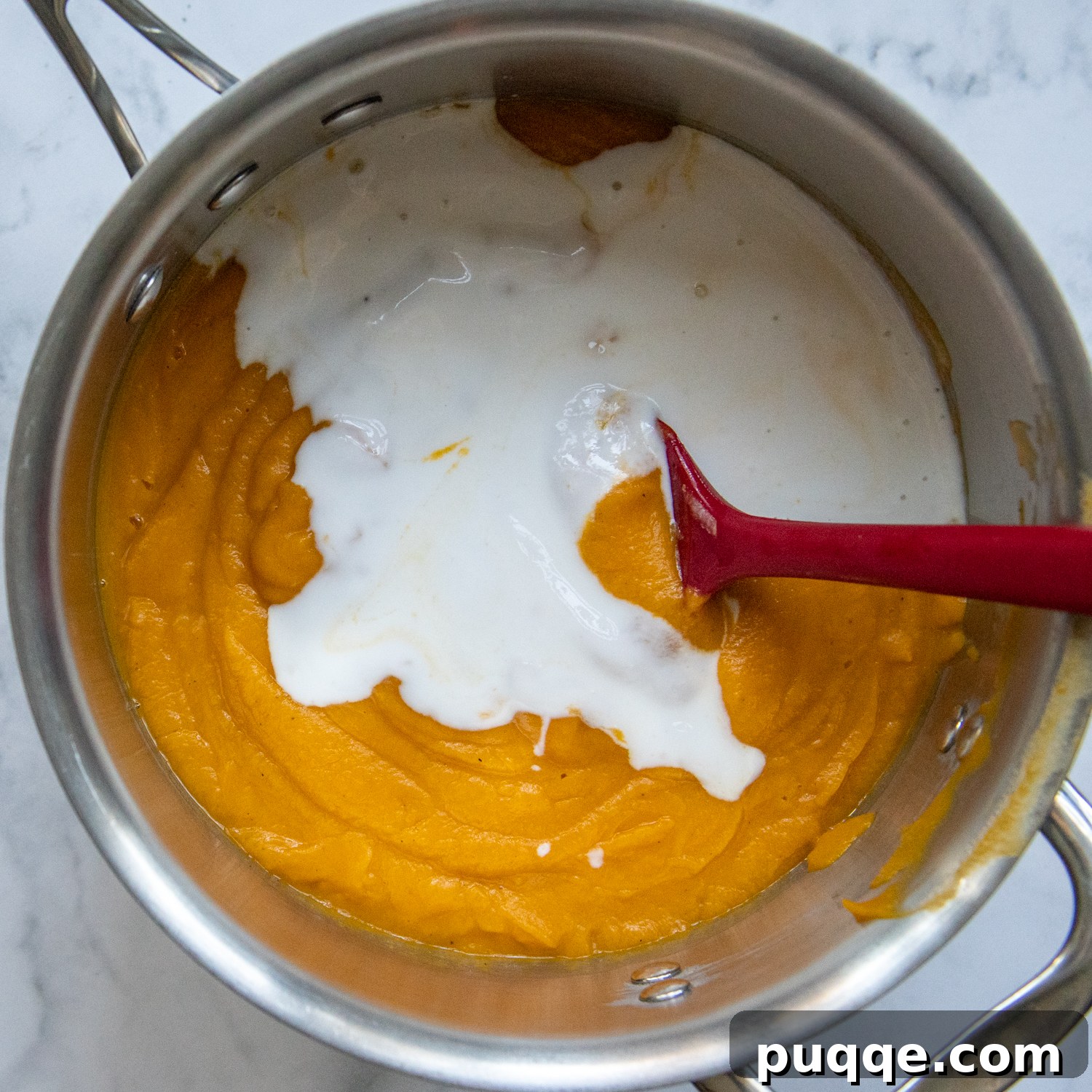 The Ultimate Panera Style Butternut Squash Soup Homemade Perfection 6 coconut milk added to the saucepan with soup.