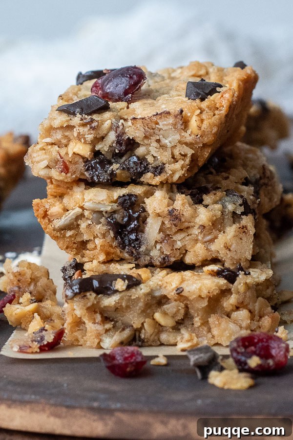 Wallet-Friendly Gluten-Free Meals: 40+ Easy Ideas 23 A stack of three homemade granola bars, with appetizing bits crumbling off the edges.