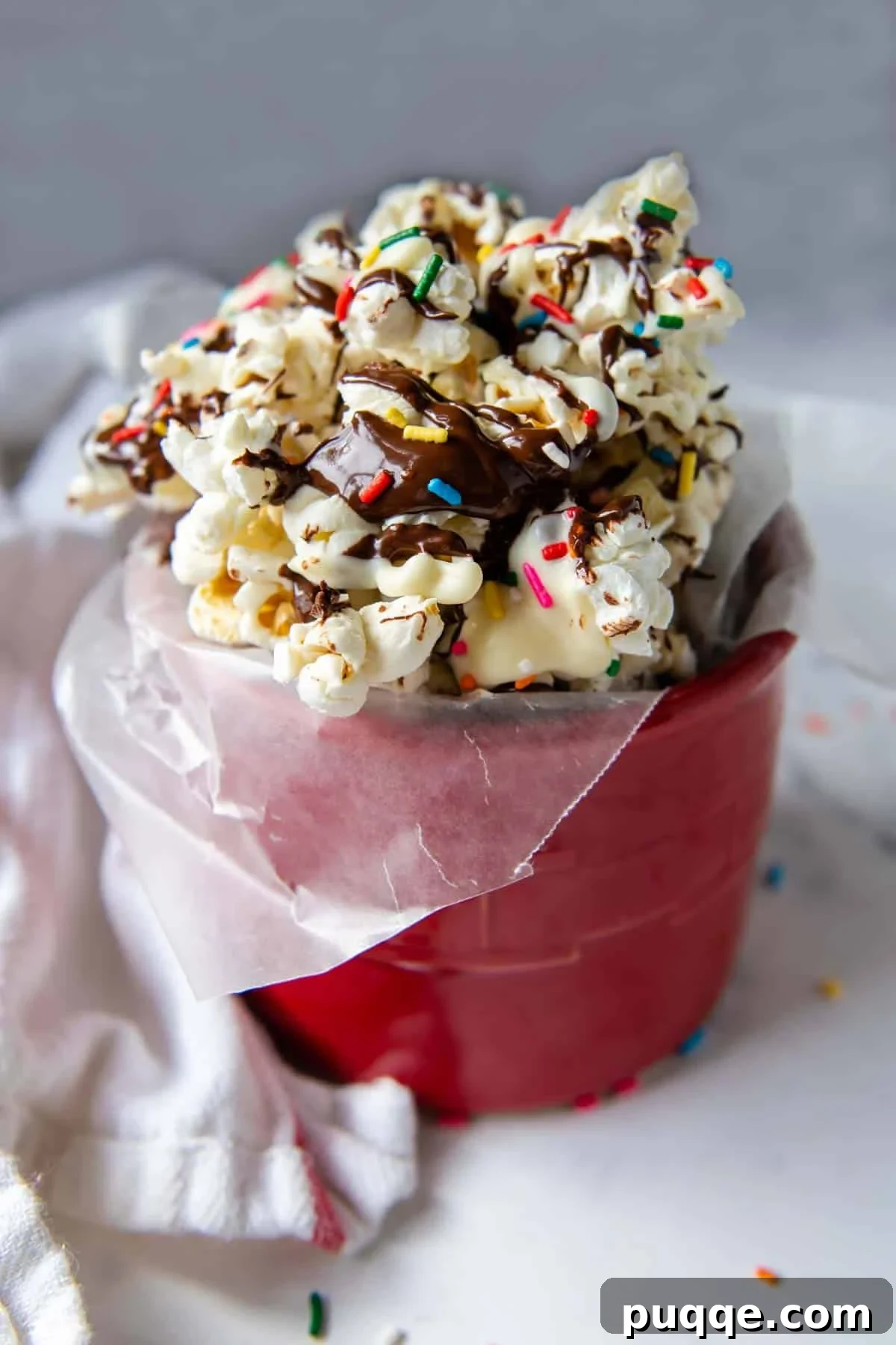 Wallet-Friendly Gluten-Free Meals: 40+ Easy Ideas 25 Close-up of fluffy chocolate popcorn topped with colorful sprinkles, a perfect party treat.