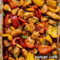 Crispy Baked Gluten-Free Sweet and Sour Chicken 8 Overhead shot of gluten-free sweet and sour chicken in a white baking dish
