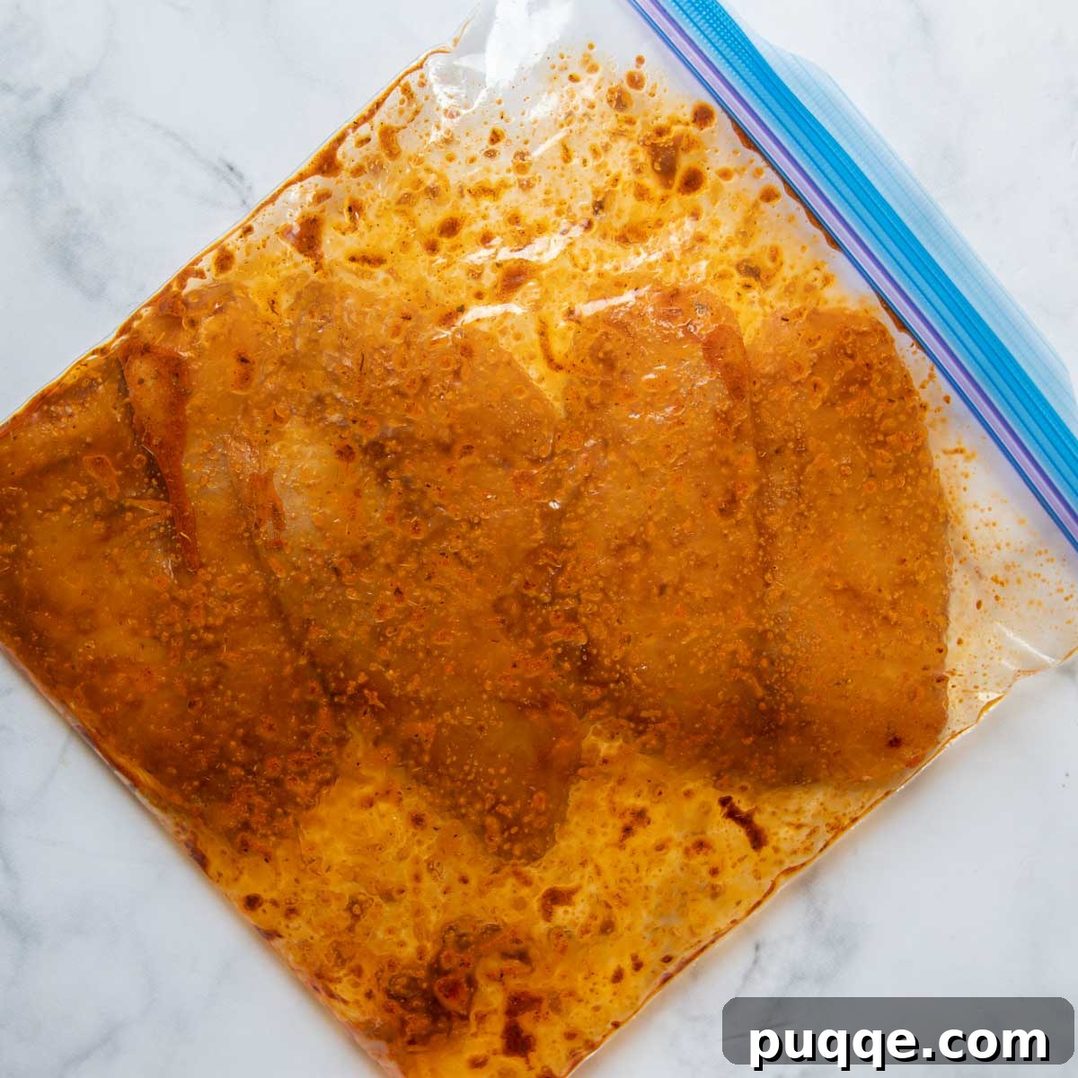 Flavorful Gluten Free Blackened Fish Tacos Ready in 30 4 Fish marinating in a resealable bag with blackened seasoning.