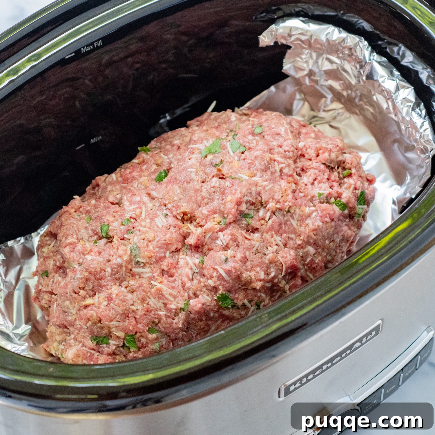 shaped meatloaf in a slow cooker.