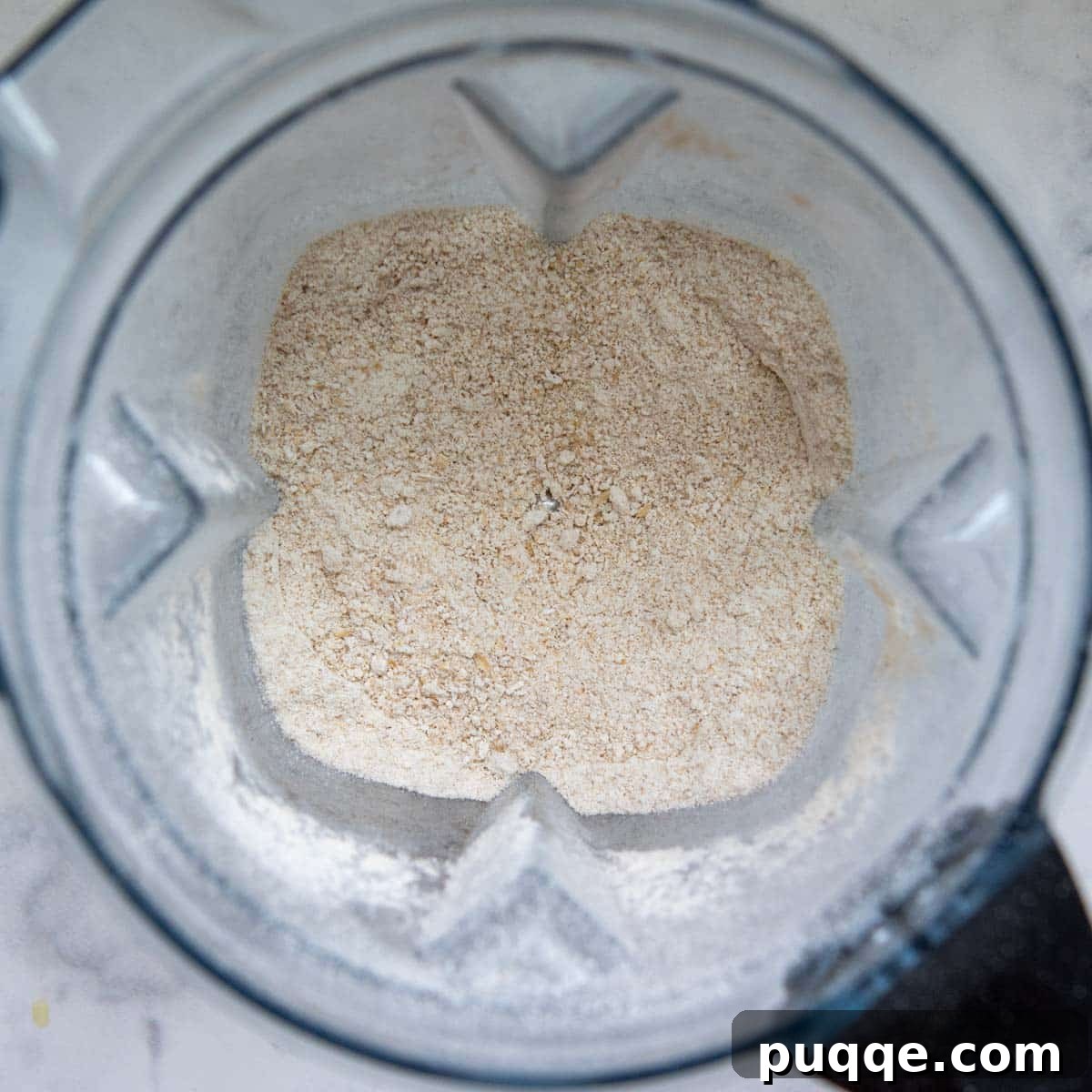 Pillowy 5-Minute Gluten-Free Oat Muffins 3 Rolled oats being blended into fine oat flour inside a high-powered blender.