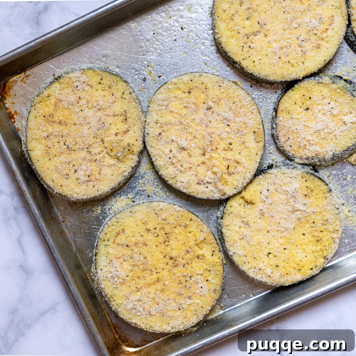 Crunchy Oven-Baked Gluten-Free Eggplant Parmesan 5 breaded eggplant before baking.