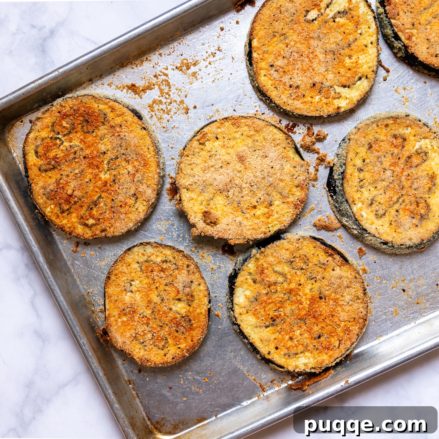 Crunchy Oven-Baked Gluten-Free Eggplant Parmesan 6 breaded eggplant after baking.