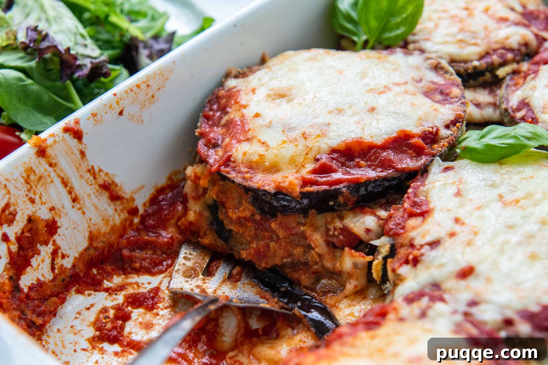 Crunchy Oven-Baked Gluten-Free Eggplant Parmesan 8 close up of eggplant cut in a baking dish