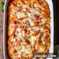 Overhead shot of creamy meatless baked ziti in a white baking dish, ready to be served.