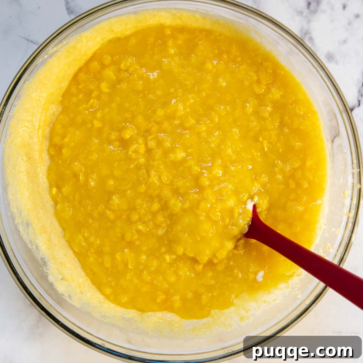 Creamy Fluffy Gluten Free Corn Casserole Made Simple 4 The smooth, creamy corn casserole batter in a large mixing bowl, ready to be transferred to a baking dish.
