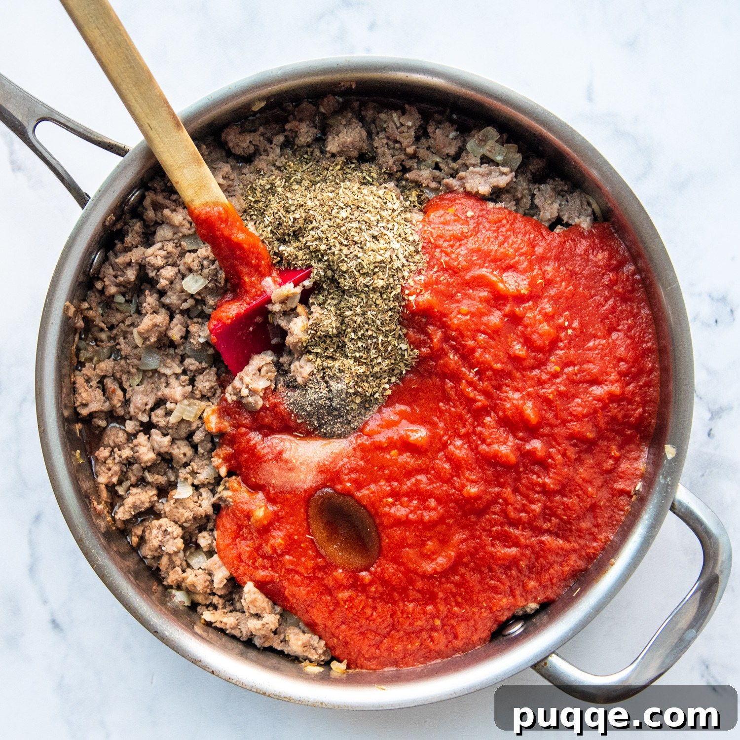 The savory lasagna meat sauce, a vibrant blend of browned meats and crushed tomatoes, gently simmering in a pan, releasing an irresistible aroma.