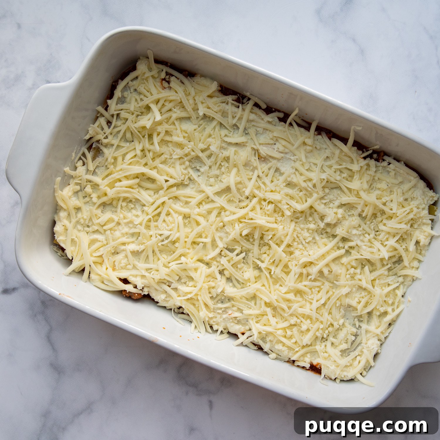 Step-by-step images illustrating the precise technique for layering lasagna, ensuring each component is perfectly placed.