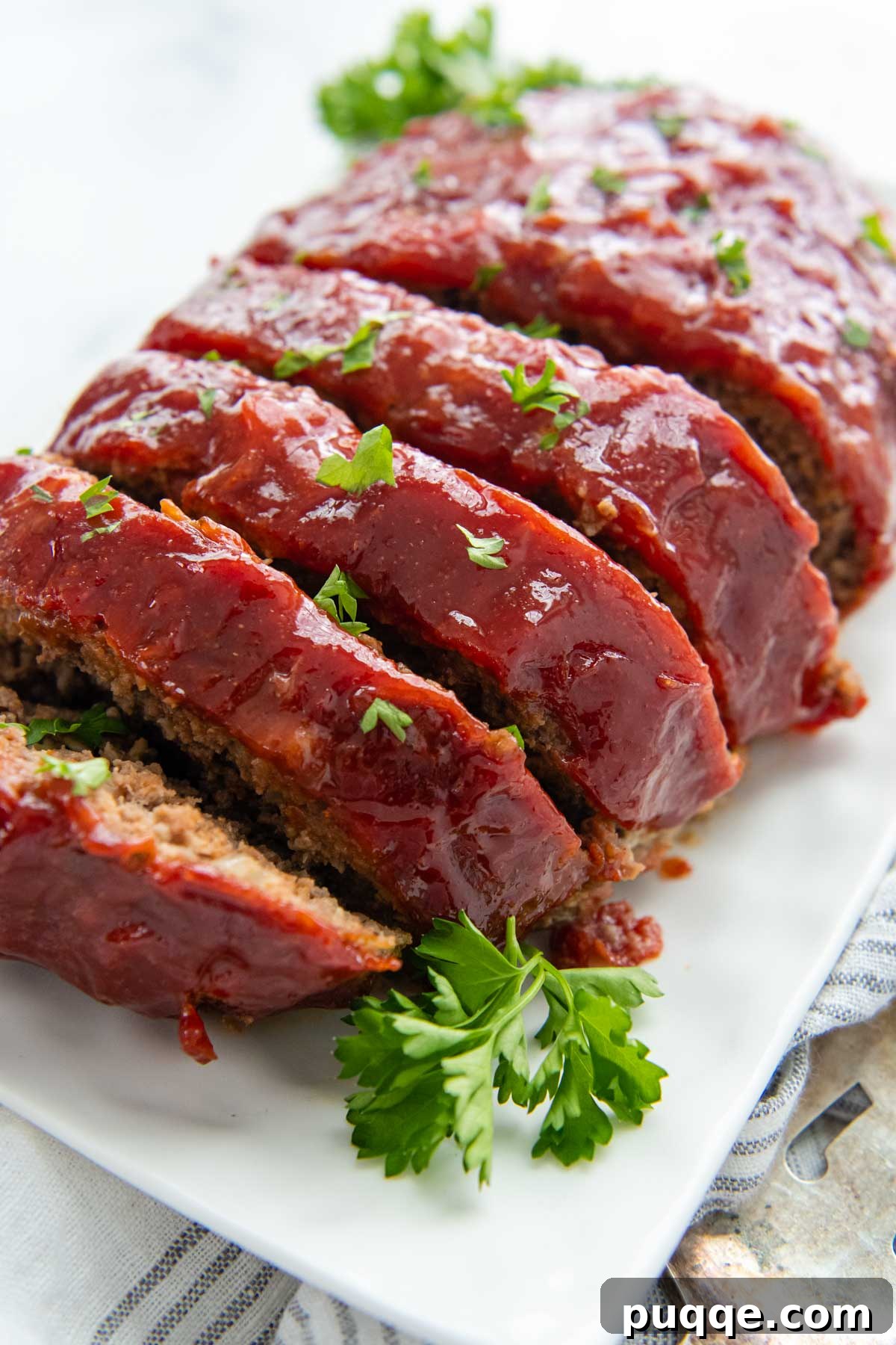 Juicy Gluten-Free Meatloaf: A Taste of Home Comfort 6 A close-up shot of the irresistible ketchup glaze coating the surface of the meatloaf, showcasing its rich, sticky texture.