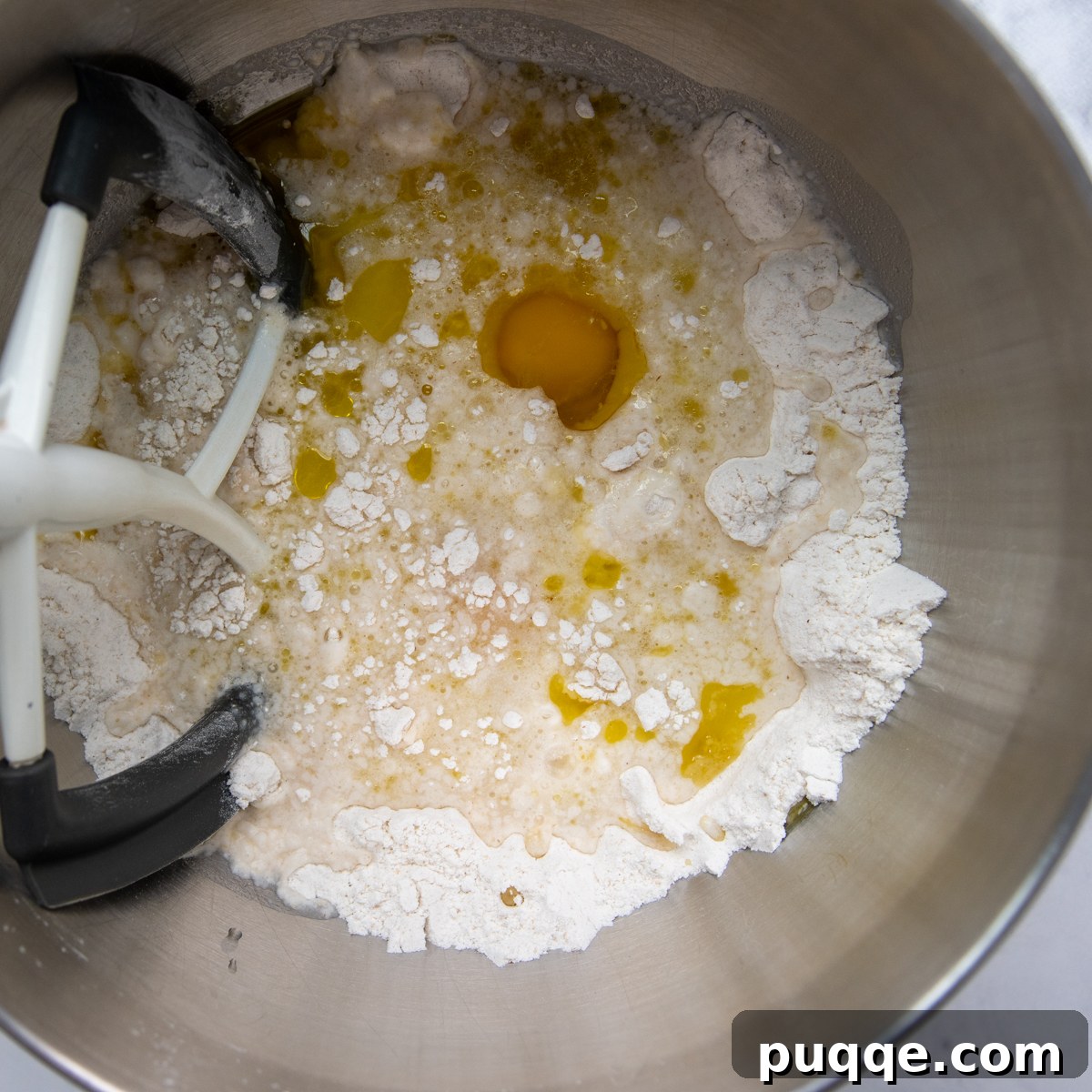 All the dry and wet ingredients for gluten-free breadsticks in a mixing bowl before combining.