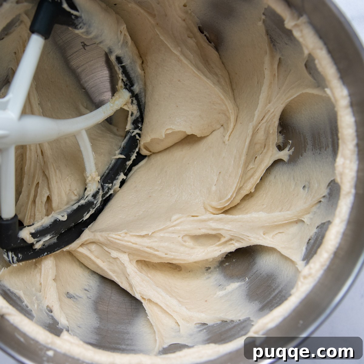 The smooth, thick brownie-like batter for gluten-free breadsticks after mixing in a stand mixer.