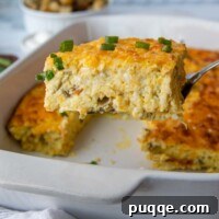 a spatula lifting out a slice of egg casserole