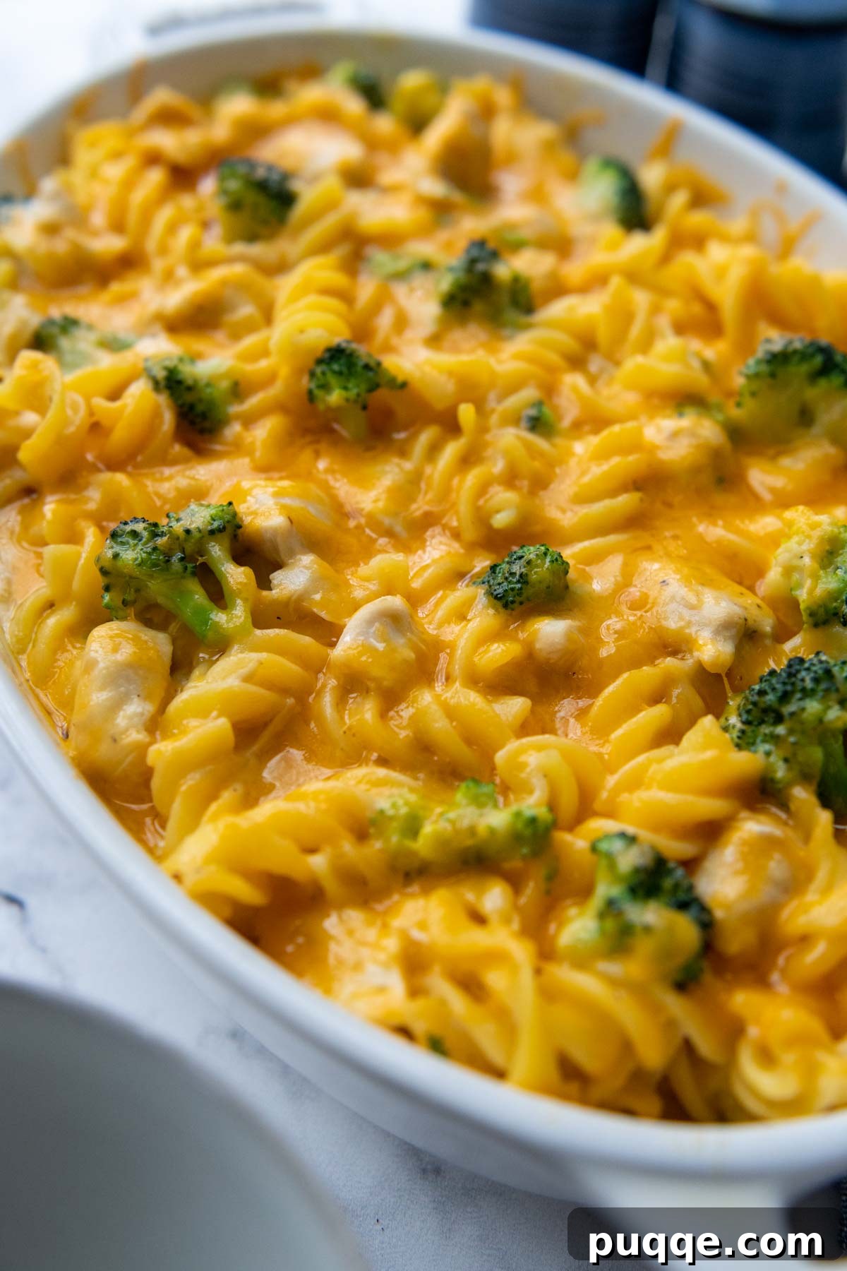 Hearty Chicken Broccoli Pasta Bake 5 close up of the inside of the pasta casserole with a scoop taken out, showing creamy sauce and ingredients