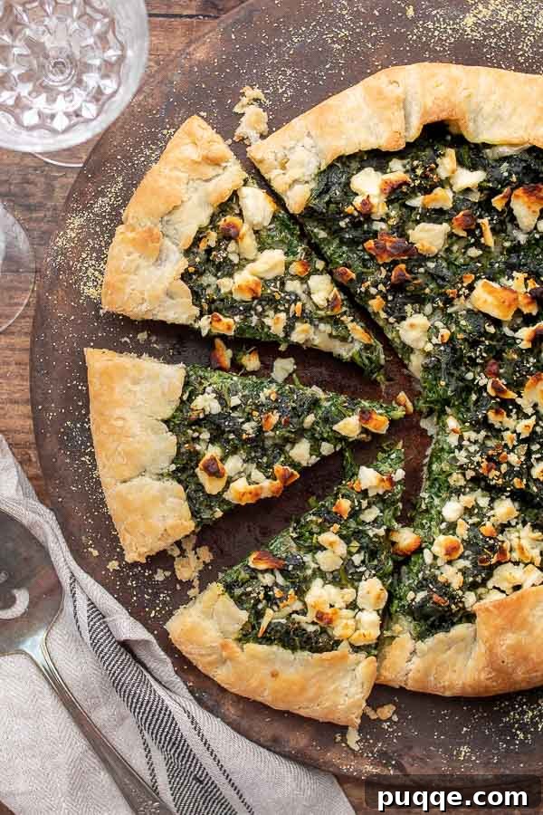 An overhead shot of a savory vegetable tart, cut into inviting slices.