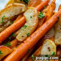 A carrot apple side dish, beautifully arranged on a white plate.