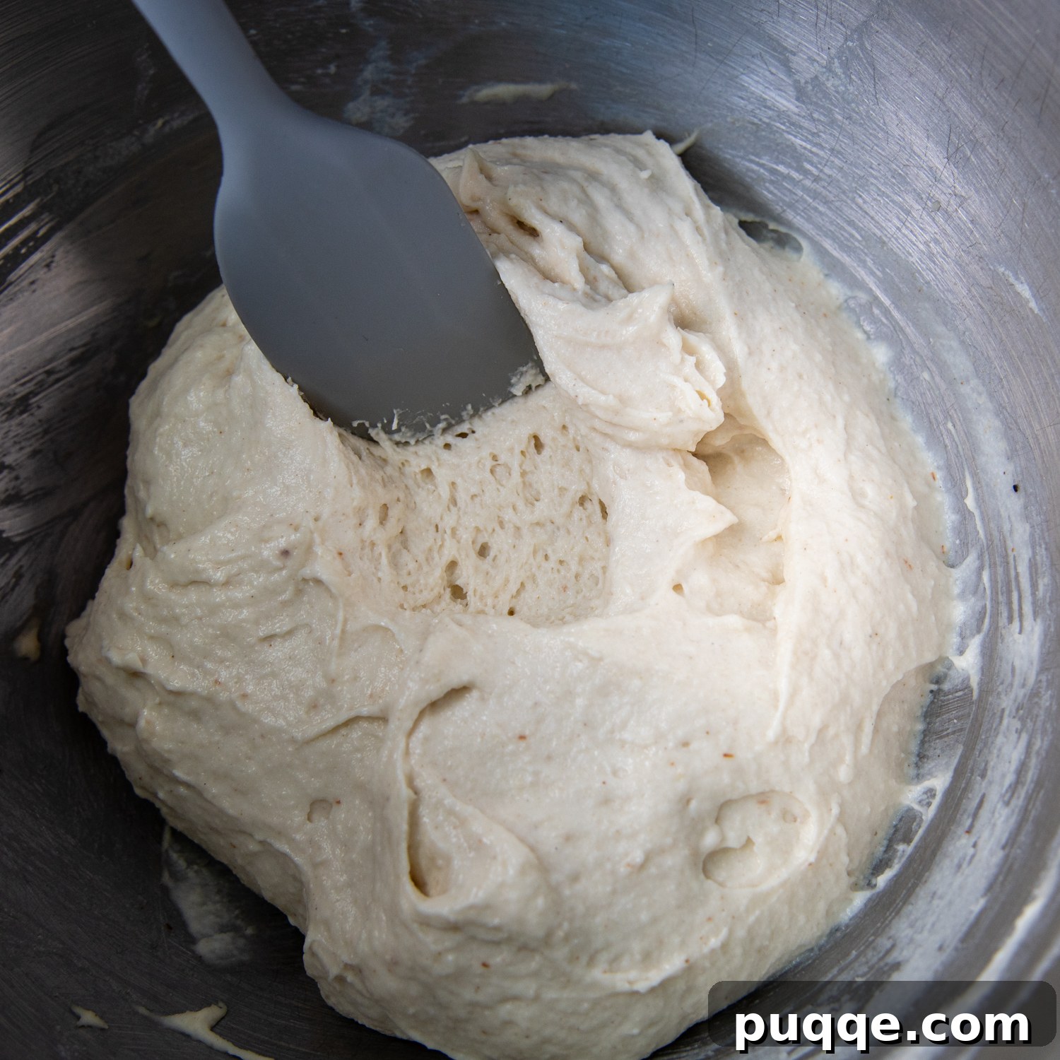 Perfectly Crispy Chewy No Knead Gluten-Free Pizza Crust 4 a spoon going into the crust to show the texture inside.