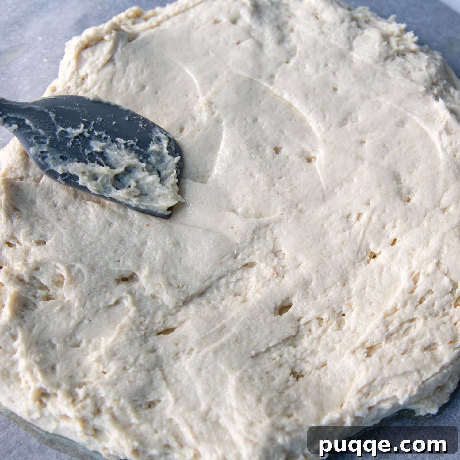 Perfectly Crispy Chewy No Knead Gluten-Free Pizza Crust 5 the dough being spread with a silicone spoon.
