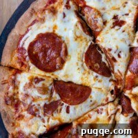 Perfectly Crispy Chewy No Knead Gluten-Free Pizza Crust 10 overhead shot of pepperoni pizza sliced