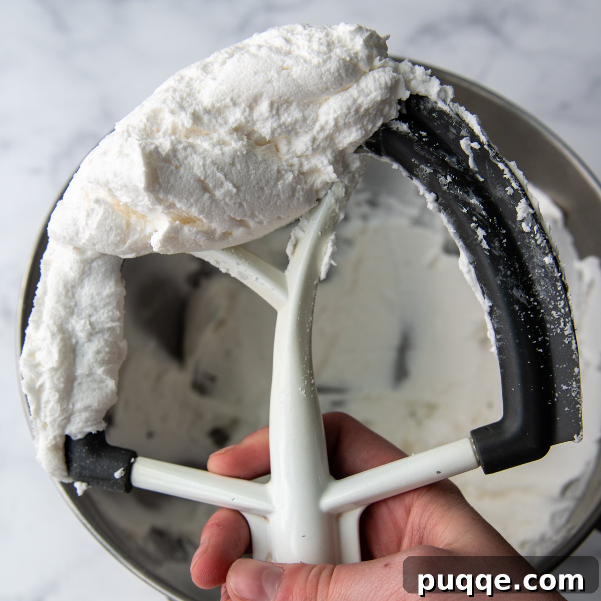 Grandma's Easy Gluten-Free Whoopie Pies 6 A stand mixer's beater lifted high, showcasing the incredibly fluffy and creamy Amish-style whoopie pie filling.