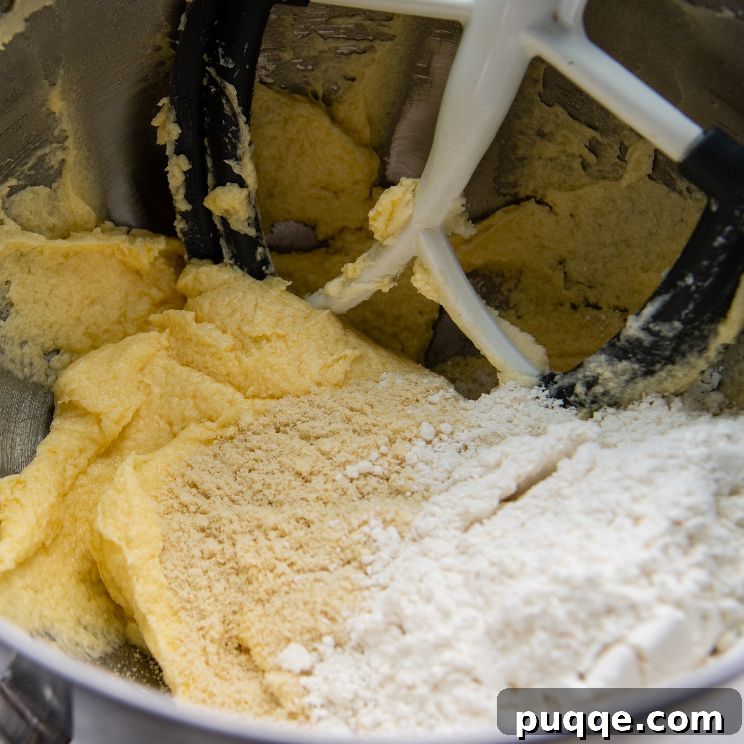 Ultimate Gluten-Free Crumbl Cookies 4 Adding the gluten-free all-purpose flour and almond flour to the wet ingredients to form the cookie dough.