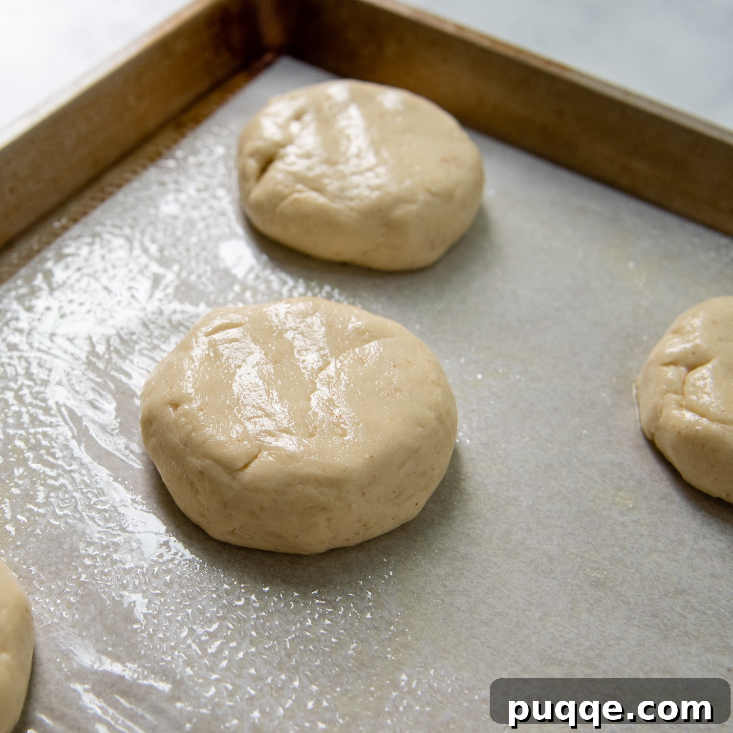 Unbelievably Soft Gluten Free Hamburger Buns No Crumbs 6 The slightly flattened gluten-free buns, covered for their crucial rising stage.