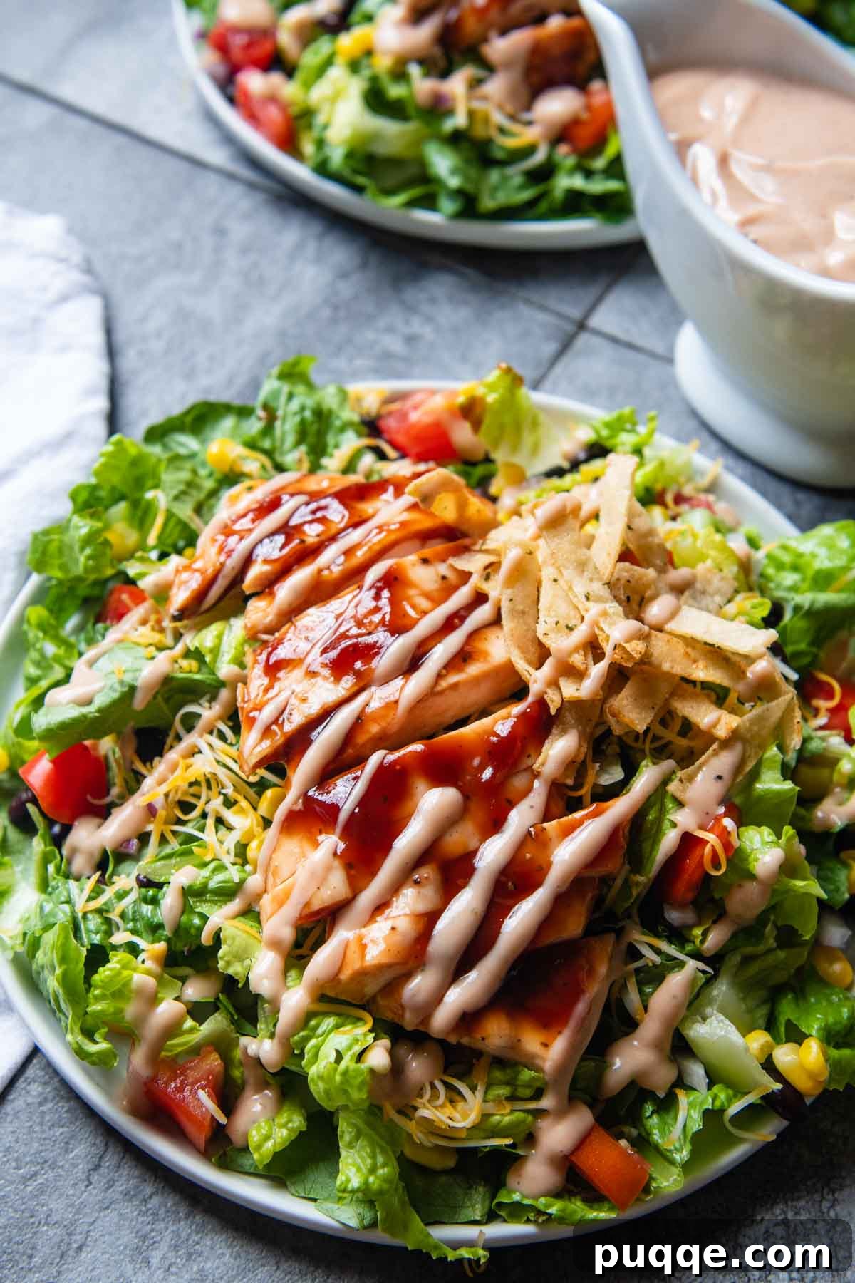 Fast BBQ Ranch Two Ways 4 A vibrant salad with grilled chicken and fresh vegetables, generously drizzled with homemade BBQ Ranch dressing.
