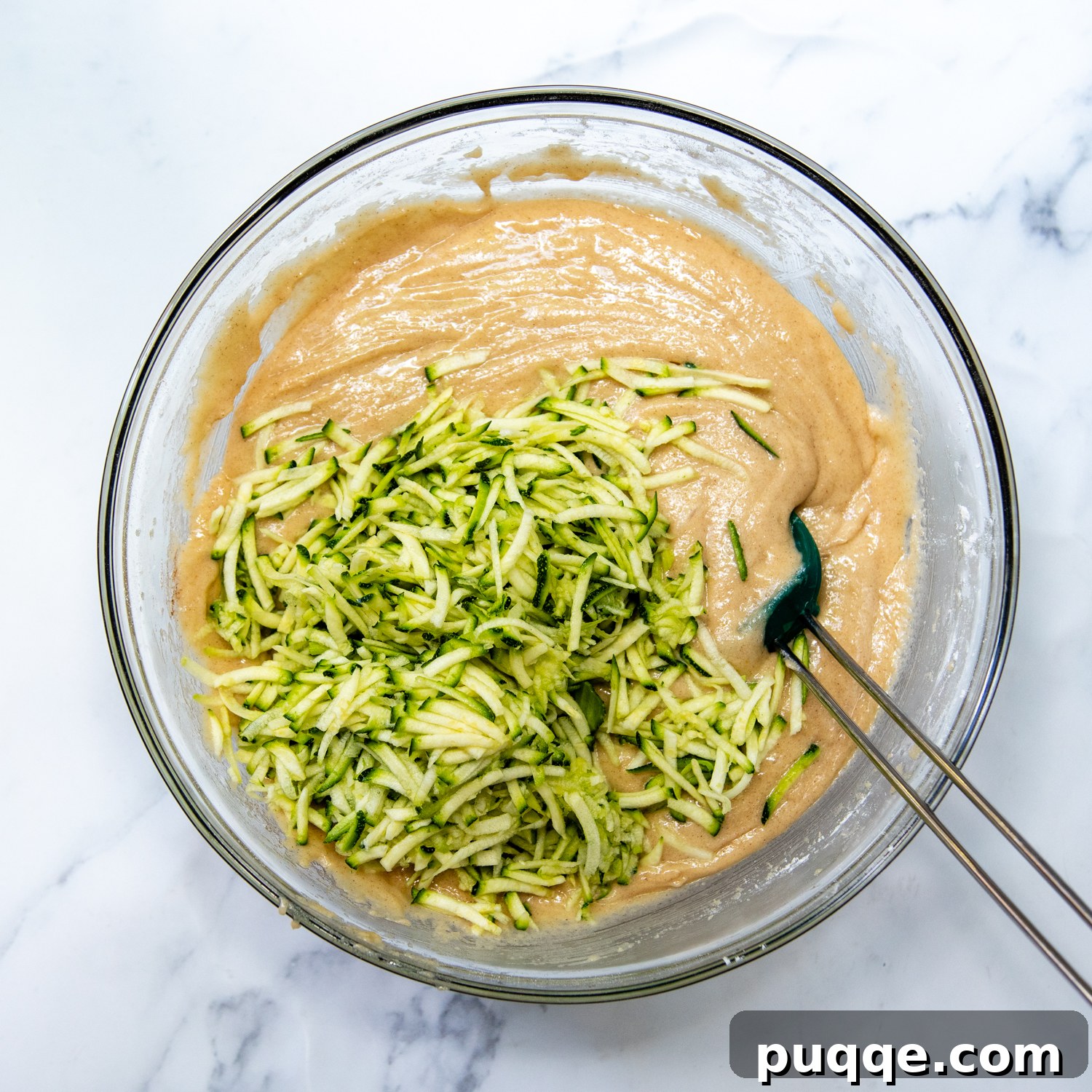 Perfectly Moist Blueberry Zucchini Bread 4 Bowl of batter with freshly grated zucchini stirred in, adding essential moisture to the quick bread.