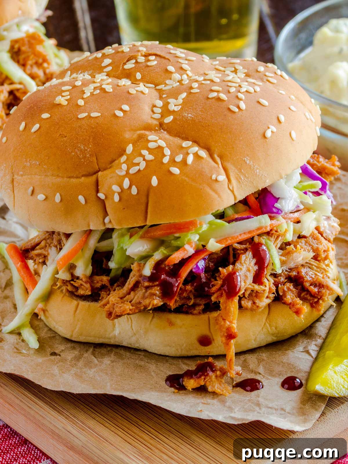 65 Must-Try Sides to Elevate Your Pulled Pork 3 a pulled pork sandwich with coleslaw on top