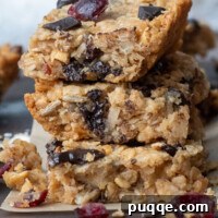 Ultimate Chewy Gluten-Free Chocolate Chip Granola Bars 9 Stack of 3 gluten-free granola bars with bits crumbling off