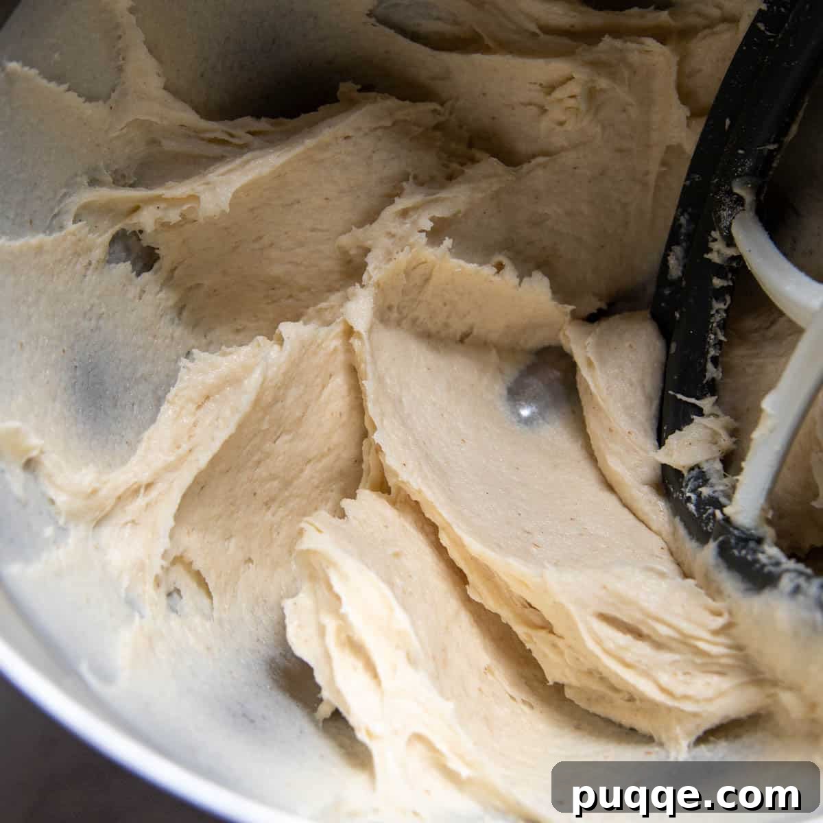 The stiff yet sticky gluten-free dough, perfectly mixed in a stand mixer bowl.